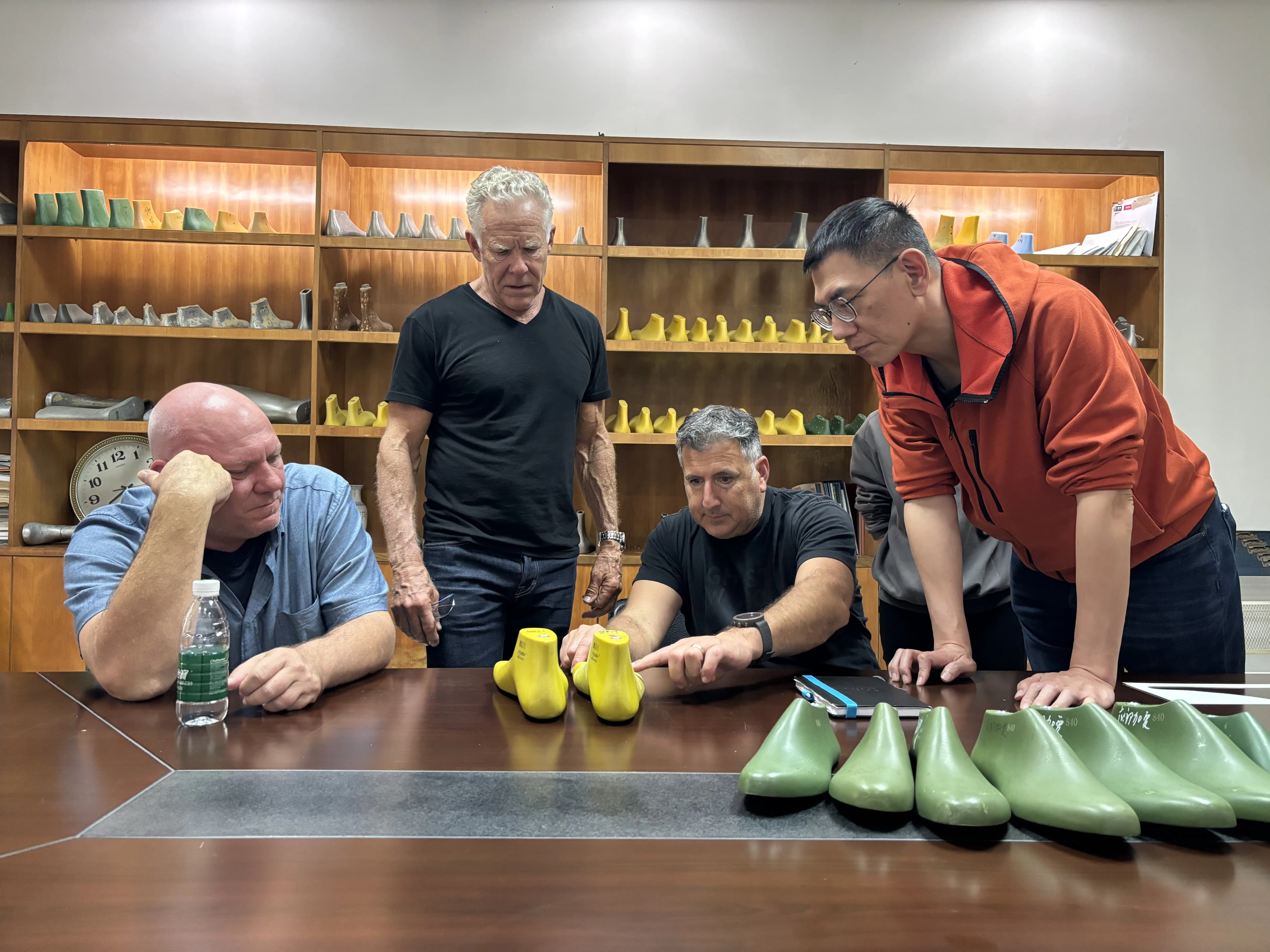 Behind-the-scenes photo of Peluva shoe prototypes and materials in the design workshop