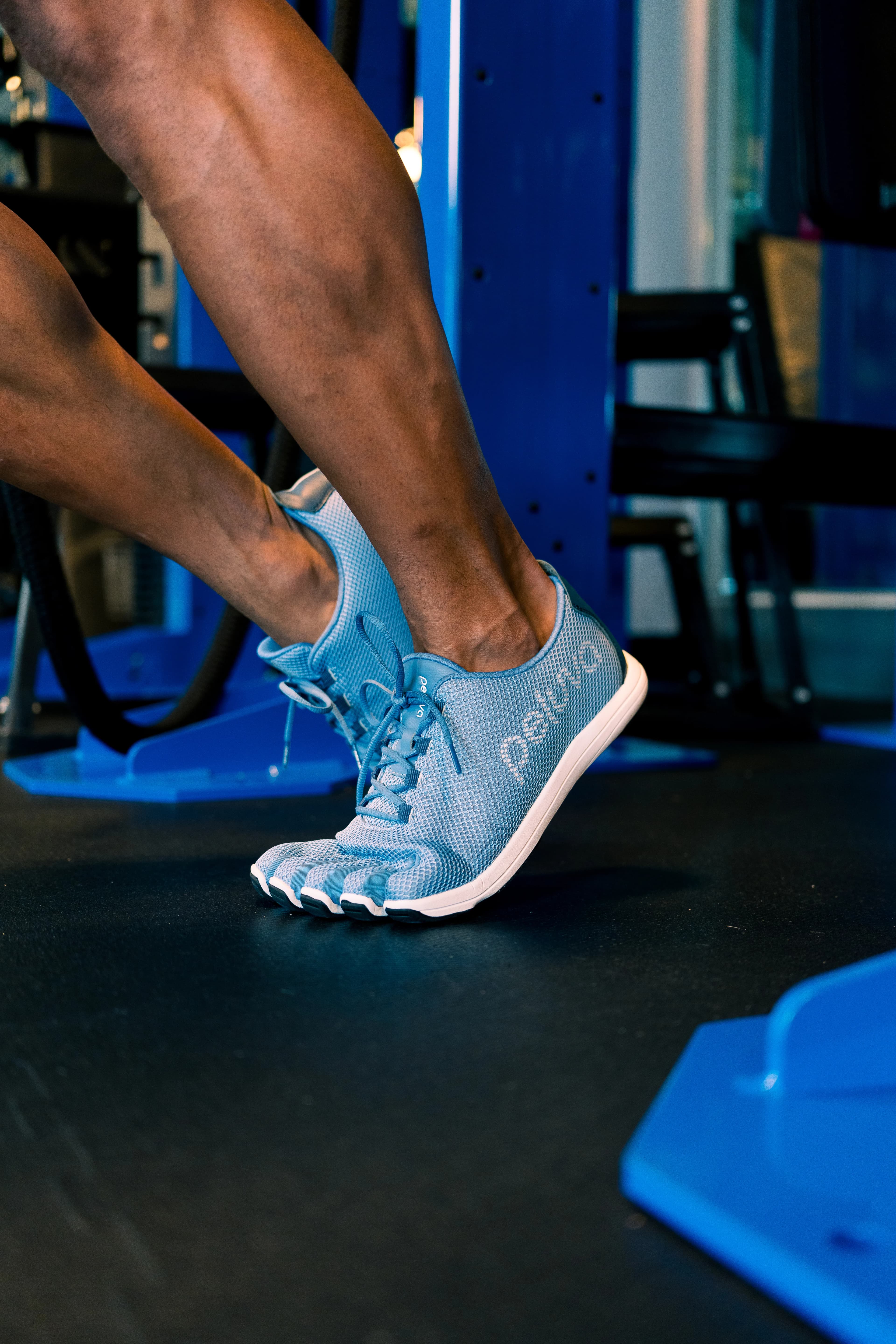 Person wearing Peluva trainers during a gym workout